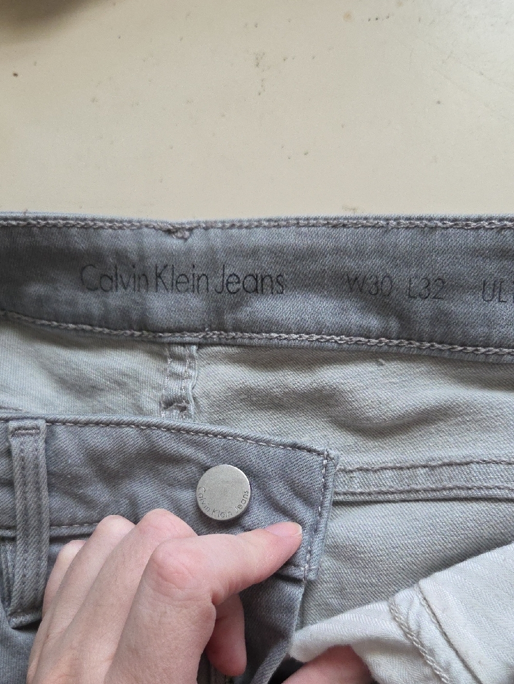 Calvin Klein Jeans gray denim jeans with branded button